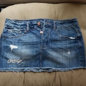 Mini distressed denim skirt
